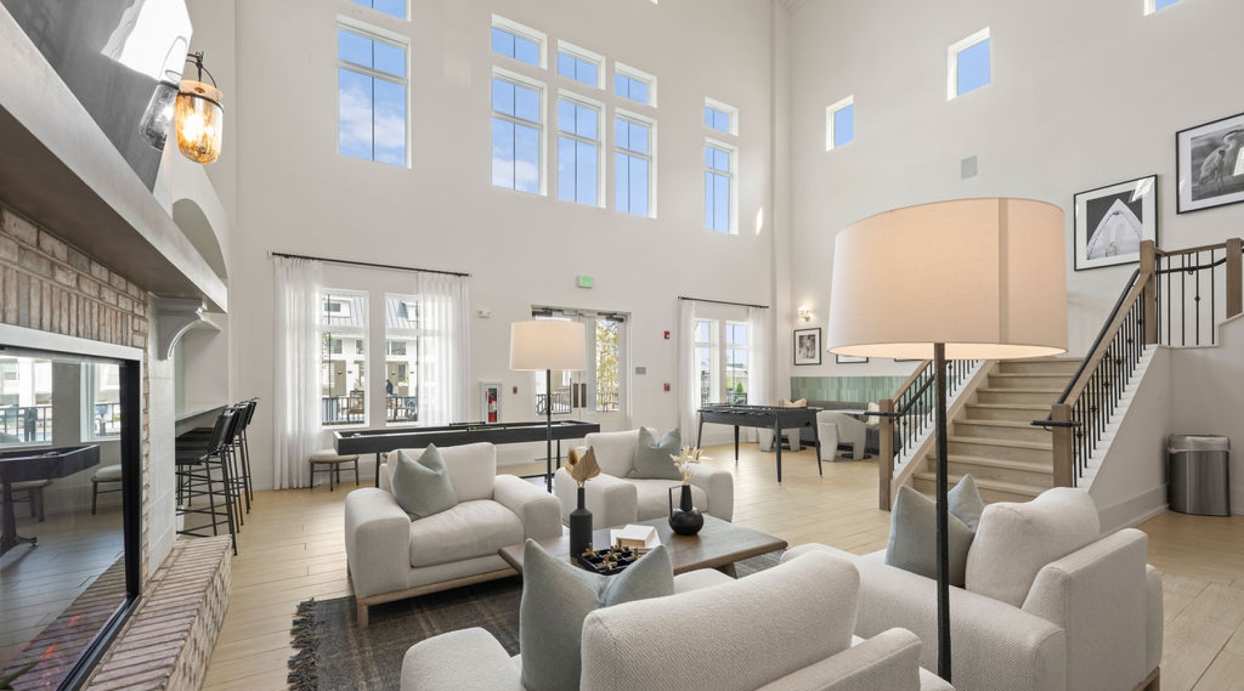 a lobby with seating and large windows