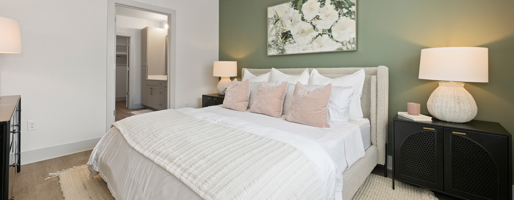 a bedroom with a bed and lamps
